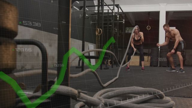 Scene shows woman engaging in rigorous exercise. Modern digital graph animation overlay adds tech element, representing integration of health analytics into workouts. Perfect for promotions about fitness tracking, technology in fitness, active lifestyle content.