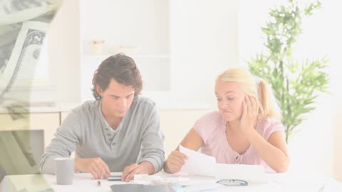 Couple Calculating Finances at Home with Digital Banknote Overlay