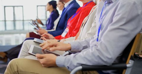 Business Professionals Using Tablets at Seminar