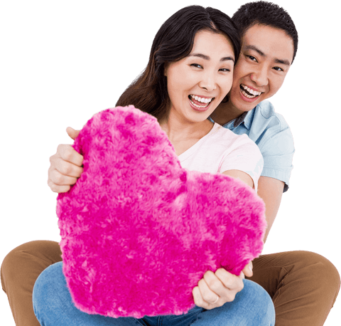 Smiling Couple Holding Pink Heart-Shaped Pillow Transparent Background