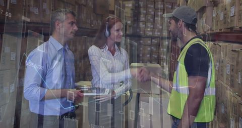 Warehouse management team discussing logistics with digital data overlay