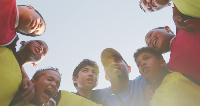 Youth Soccer Team Huddling with Coach, Sunshine - Download Free Stock Images Pikwizard.com