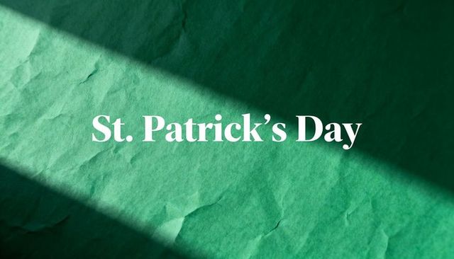 St. Patrick's day typography on crumpled emerald paper with diagonal shadow