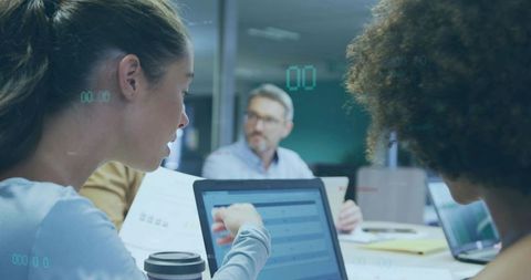 Team Collaborating Strategically Over Project in Office