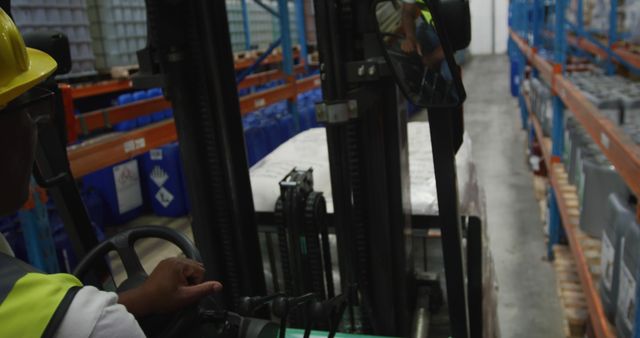 Warehouse Worker Operating Forklift Moving Goods Through Aisles - Download Free Stock Images Pikwizard.com