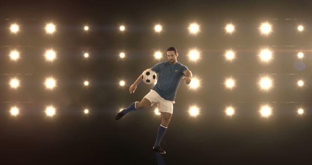 Soccer player in blue uniform performing football skills under bright studio lights. Perfect for sports ads, athletic promotion, soccer training materials, or performance art projects.