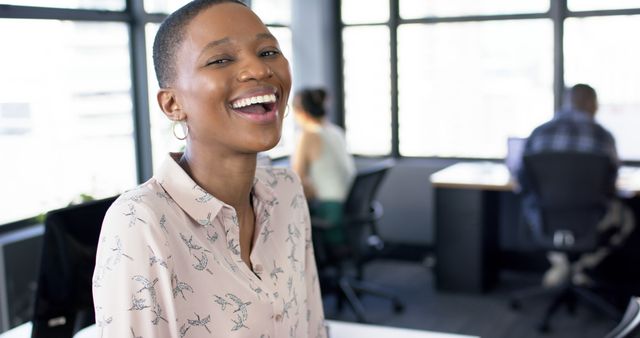 Joyful African American Businesswoman Smiling in Modern Office Environment - Download Free Stock Images Pikwizard.com