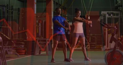 Kettlebell swing partners training on gym turf with red performance graph overlay