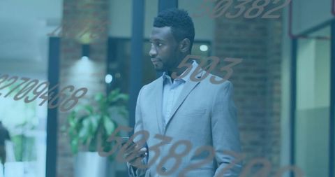 Confident Professional Analyzing Digital Data in Modern Office