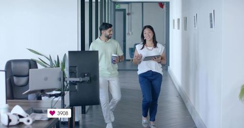 Colleagues Engaging in Office Hallway Discussion