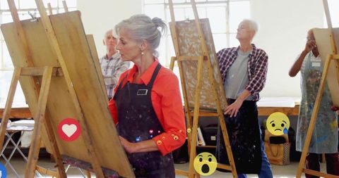 Mature Artists Engage in Collaborative Creativity at Art Studio