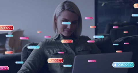 Woman working remotely on laptop at home with augmented reality notification overlays