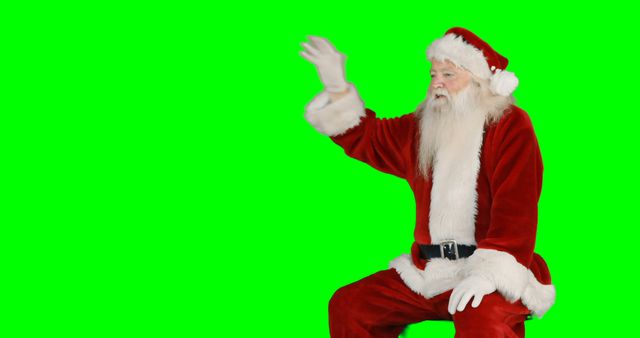 Santa Claus Waving in Front of Green Screen - Download Free Stock Images Pikwizard.com