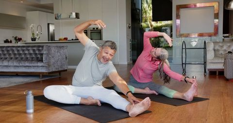 Senior Couple Practicing Yoga Home Fitness and Mindfulness