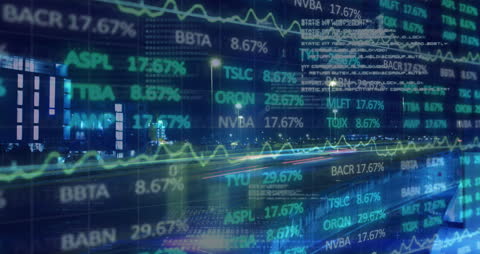 Animated Financial Graphs and Data Overlaying Night Cityscape Traffic