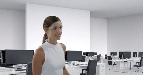 Businesswoman with smart glasses interacting with digital screen