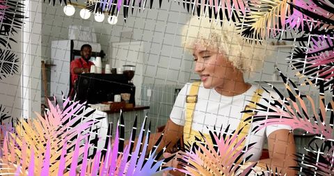 Smiling Woman Enjoying Coffee at Trendy Cafe with Tropical Touch
