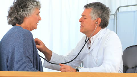 Senior Patient Consulting with Caring Doctor for Health Checkup