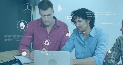 Coworkers Collaborating on Technology Project with Digital Interface