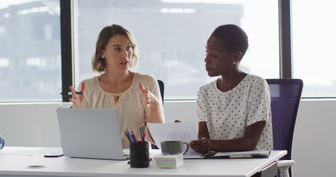 Two Professional Women Discussing Work at Modern Office - Download Free Stock Images Pikwizard.com