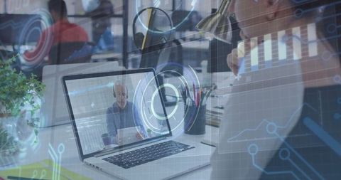 Virtual meeting on laptop with digital data overlay illustrating remote work