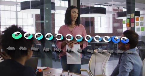 Diverse Team Discussing Data Trends in Modern Office Setting