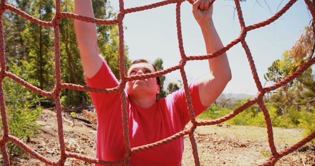 Determined Man Climbing Outdoor Obstacle Course Rope Net - Download Free Stock Images Pikwizard.com