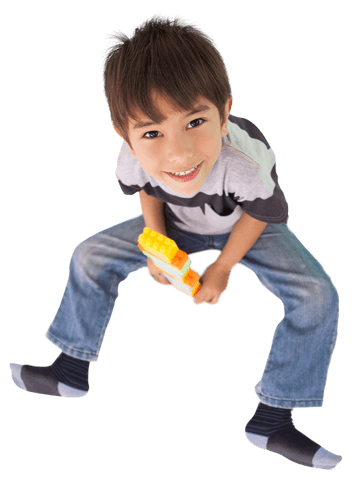 Smiling Boy Playing with Toy Blocks on Transparent Background