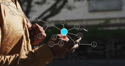 African american man using smartphone with network overlay