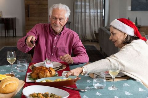 Festive Gathering Senior Couple Celebrating Holiday Meal