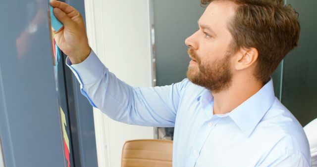 Businessman Writing Notes on Office Whiteboard - Download Free Stock Images Pikwizard.com