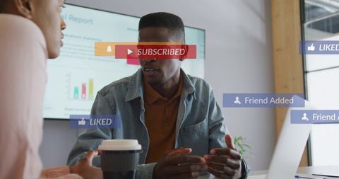Male colleague discussing data presentation with social media notification overlays