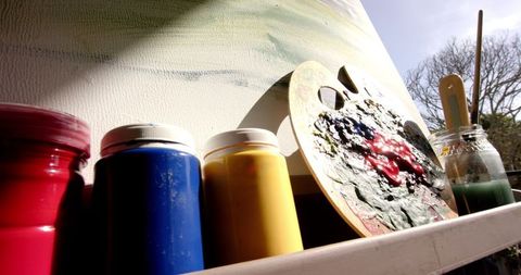 Vibrant art supplies in sunlit studio