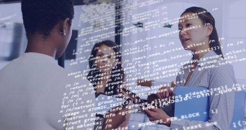Diverse professional women collaborating on software project with tablet and code overlay