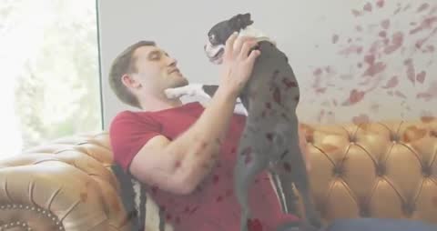 Man Enjoying Playful Moment with Energetic Dog