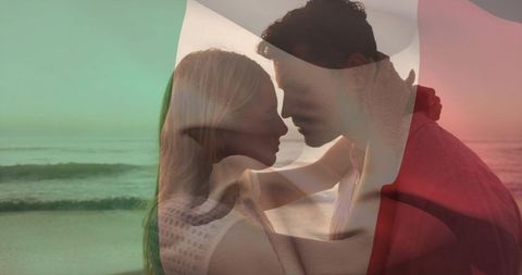 Romantic double exposure of embracing couple on shoreline with tricolor overlay and sunset