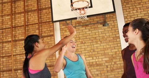 Teenagers Celebrating After Game by Giving High Fives in Gym - Download Free Stock Images Pikwizard.com