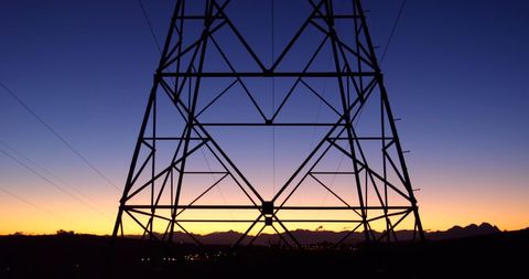 Electricity Pylon Silhouetted Against Vibrant Dusk Sky - Download Free Stock Images Pikwizard.com