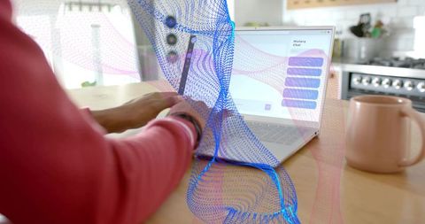 Woman Uses Laptop at Kitchen Table with Digital Wave Overlay