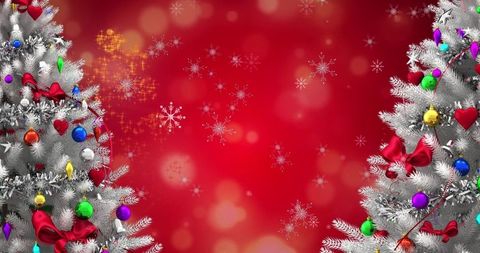 Festive silver fir branches on red with baubles and snowflakes