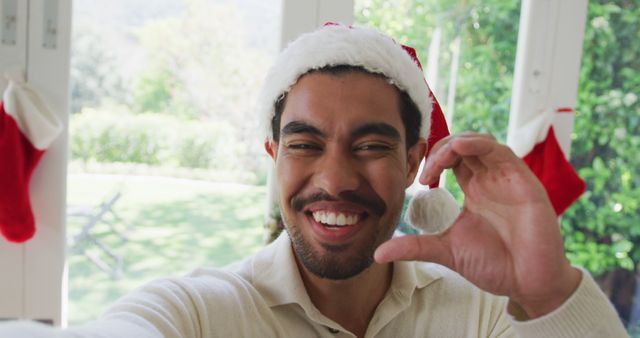 Smiling Young Man Taking Christmas Selfie at Home - Download Free Stock Images Pikwizard.com