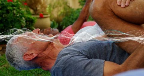 Senior man stretching on lawn with wellness wave overlay promoting calm outdoor exercise