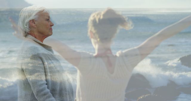 An elderly woman stands by the ocean looking reflective as the silhouette of a younger woman joyously raises her arms in the background. Ideal for themes of reflection, life journey, freedom, and the beauty of nature. Suitable for articles on aging, the passage of time, personal growth, and inspirational content.