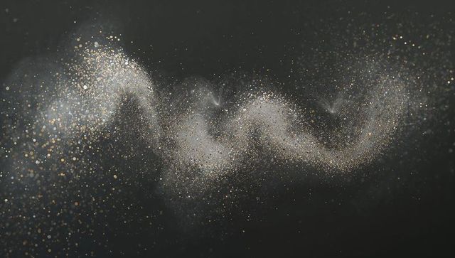 Swirling Gold Silver Particle Cloud Creating Metallic Nebula on Dark Charcoal Backdrop