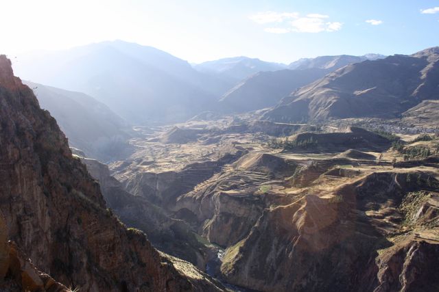 This image captures the stunning and dramatic landscape of Colca Canyon in Peru. Ideal for use in travel brochures, outdoor adventure posters, or websites promoting tourism in South America. The rugged terrain and natural beauty offer inspiration for hiking enthusiasts and nature lovers.