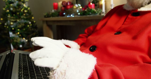 Santa Claus Typing on Laptop in Christmas Setting - Download Free Stock Images Pikwizard.com