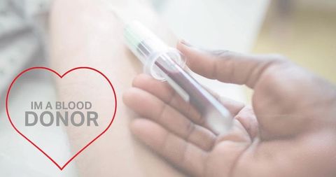 Close-up blood donation with heart campaign messaging