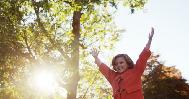 Joyful Child Playing Outdoors with Autumn Leaves - Download Free Stock Images Pikwizard.com