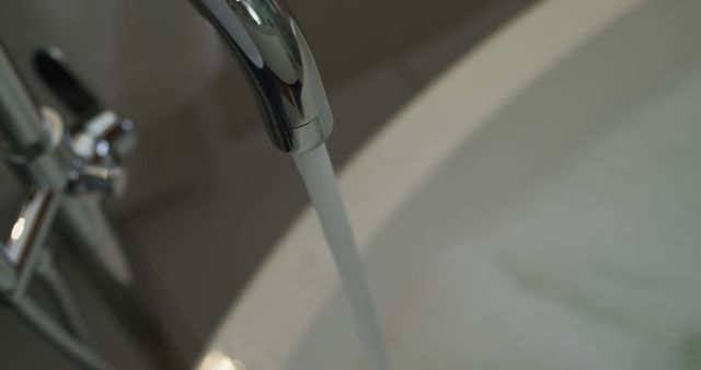 Close-Up of Water Flowing from Faucet into Bathtub - Download Free Stock Images Pikwizard.com