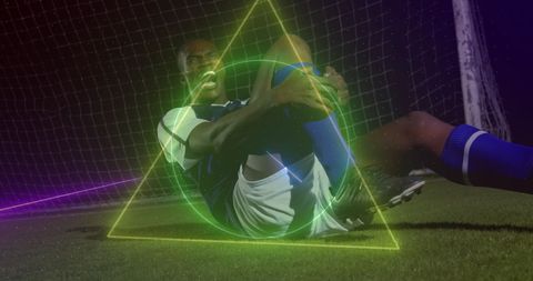 Dynamic Soccer Player Injured on Field with Neon Overlay
